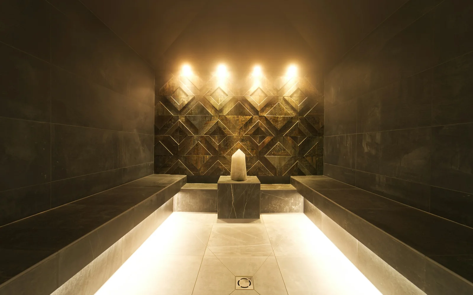 A modern stone-clad spa steam room