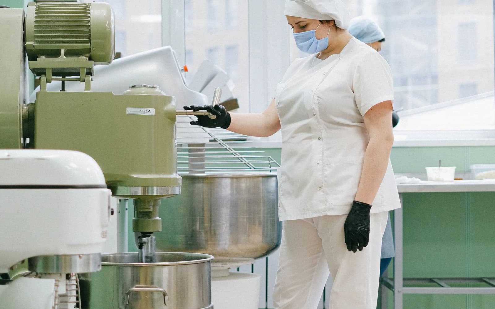 Operators working in an industrial food production facility